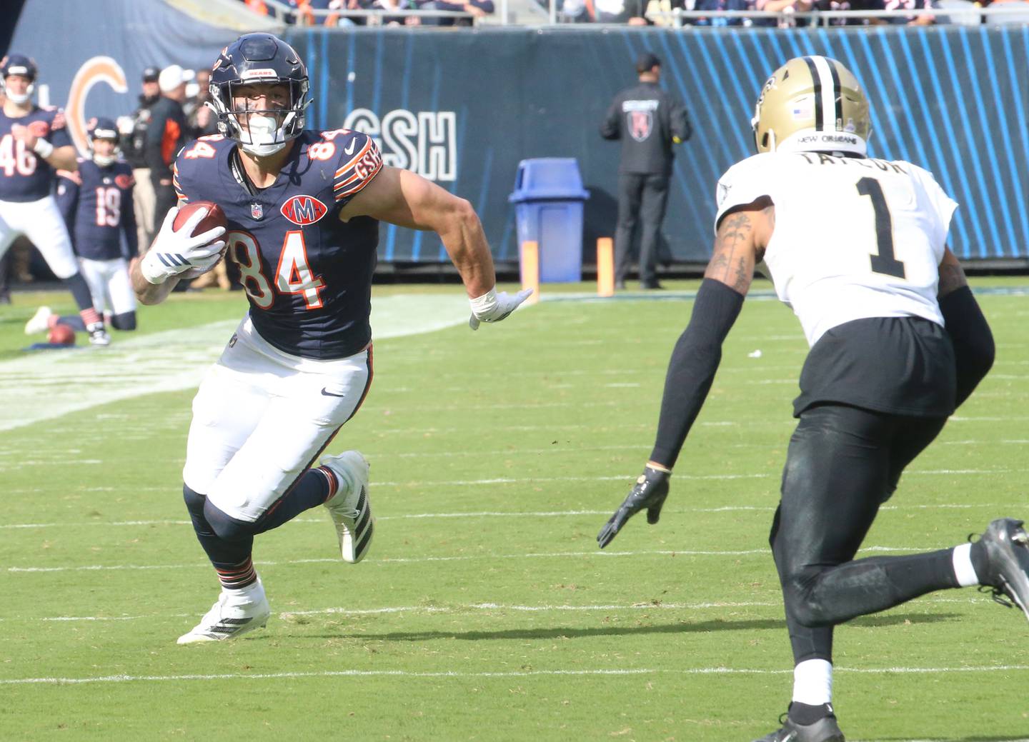 Chicago Bears tight end Colston Loveland runs with the ball as New Orleans Saints corner back Alontae Taylor looks to make a defensive play on Sunday, Oct .11, 2025 at Soldier Field in Chicago.