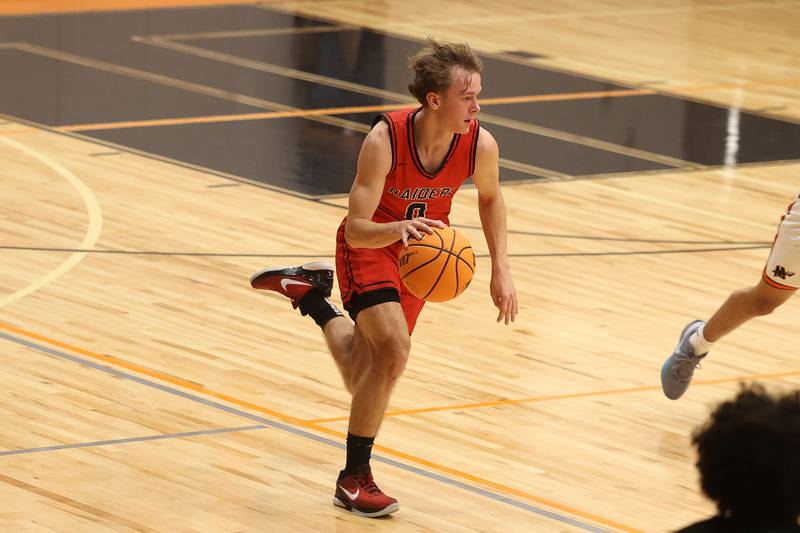 Bolingbrook’s Trey Brost works the ball upcourt against Minooka on Tuesday, Dec. 17, 2024 in Minooka.