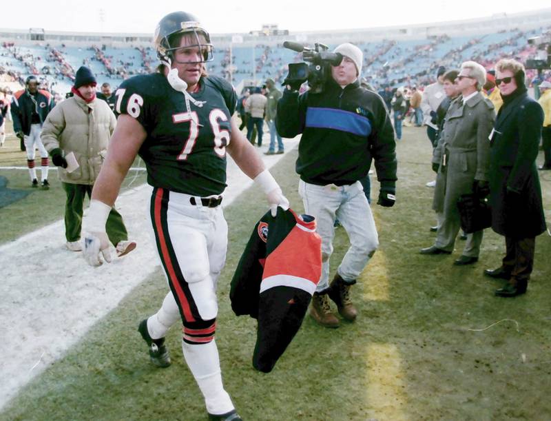 Chicago Bears defensive lineman Steve McMichael walks off the field after a game against the Tampa Bay Buccaneers in 1992.