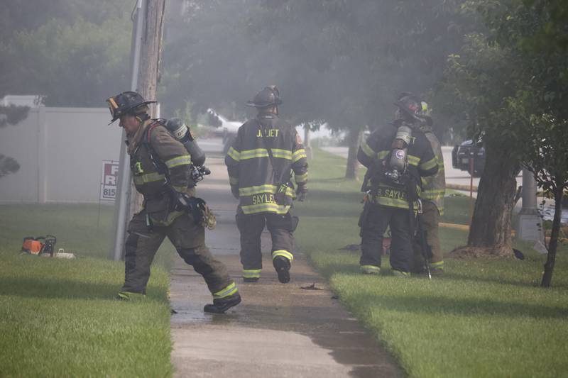 Joliet firefighters at the scene of a fire at an apartment building on Tuesday, June 10, 2025, near Essington Road in Joliet.