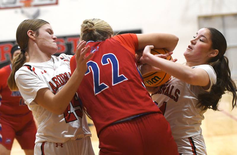 Forreston's Alice Kobler (right) and Grace Holaday (left) battle Morrison's Avery White for the ball at the Forreston High School Girls Basketball Thanksgiving Tournament on Friday, Nov. 21, 2025 in Forreston.