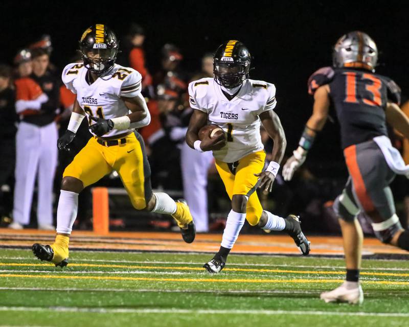 Joliet West's Carl Bew (1) runs on a keeper during varsity football game between Joliet West at Minooka.  Sept 2, 2022