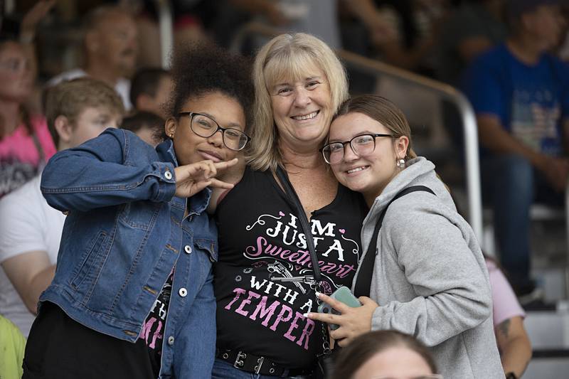 Anyha Dirks (left), Tammy Thorpe and Nakynzy Cavazos smile for a picture Wednesday, August 14, 2024, at the Whiteside County Fair in Morrison.