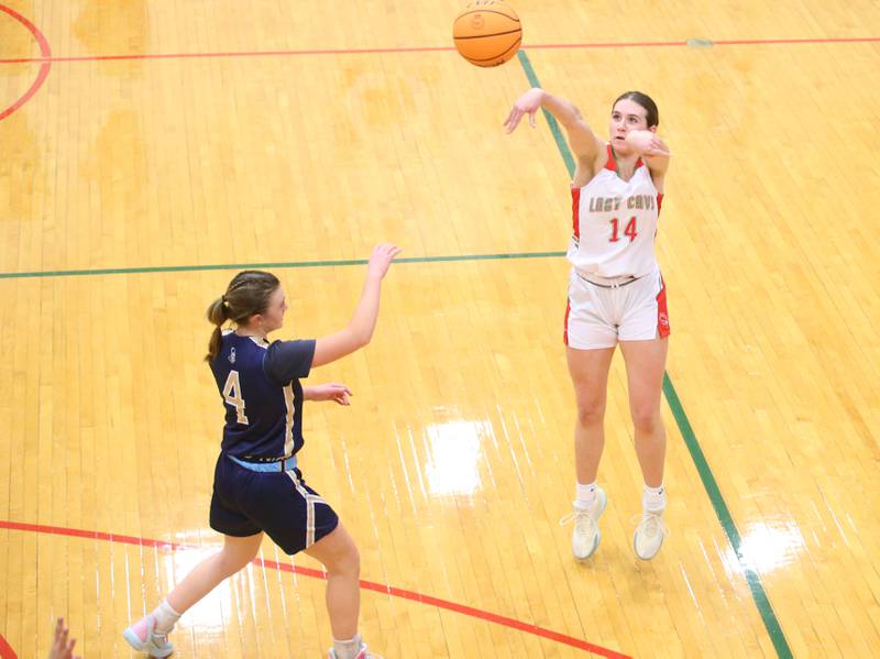 L-P's Drew Depenbrock shoots s wide-open shot over Marquette's Hunter Hopkins on Saturday, Jan. 4, 2025 in Sellett Gymnasium at L-P High School.