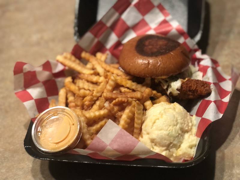 Chicken sandwich, crinkle cut french fries, potato salad and a cup of the 24K special sauce at Byrds Hot Chicken in Algonquin Commons.