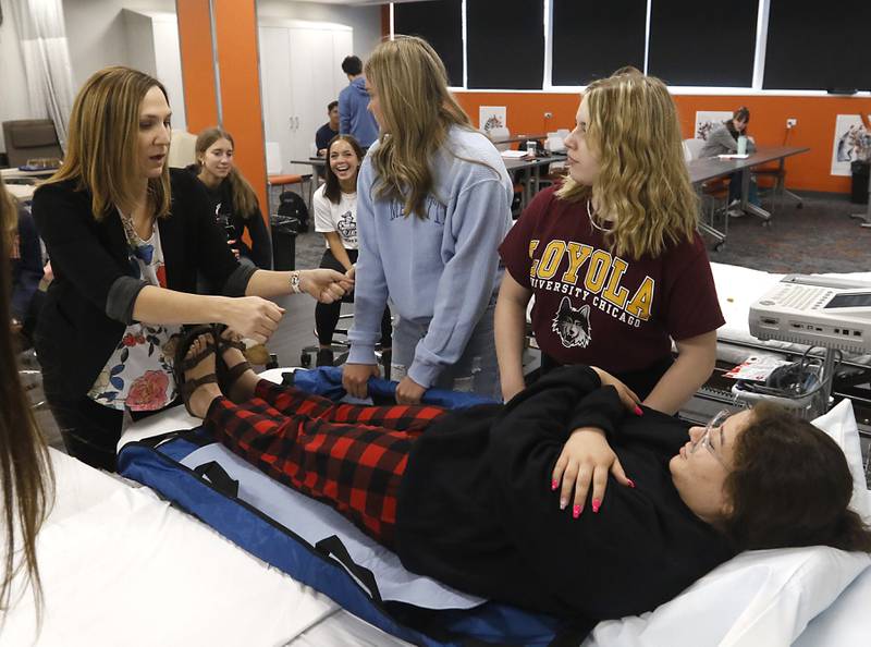 Nurse Andrea Miculinich teaches a certified nursing assistant class on Friday, April 28, 2023, at Crystal Lake Central High School.