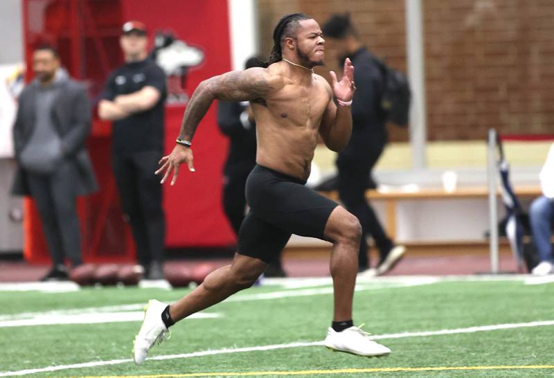 Former Northern Illinois University linebacker Lance DeVeaux Jr. runs the 40-yard dash Wednesday, March 30, 2022, during pro day in the Chessick Practice Center at NIU. Several NFL teams had scouts on hand to evaluate the players ahead of the upcoming draft.