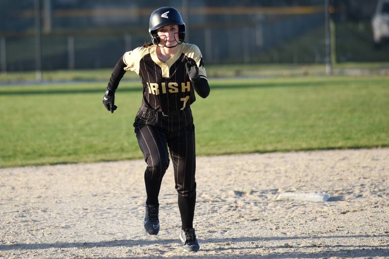 Bishop McNamara's Lily Goselin runs towards third base before eventually coming around to score a run during a home game against Peotone Monday, March 23, 2026.
