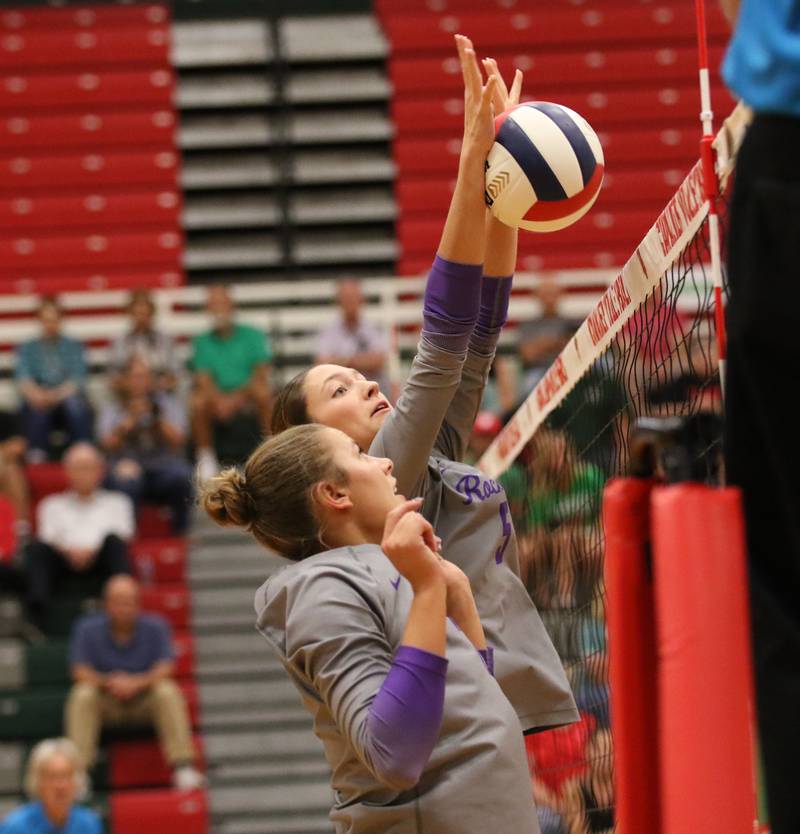 Rochelle's Audyn Kemp (5) goes high for a block during the Hubs' match with La Salle-Peru.