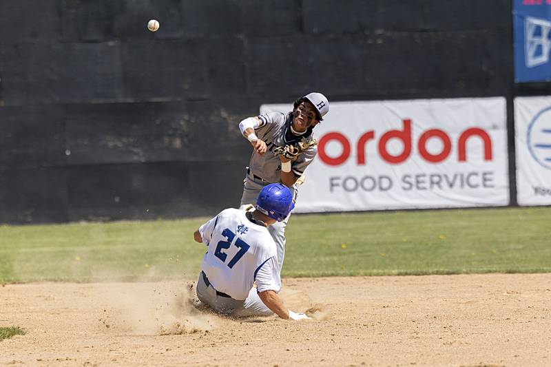Newman’s Brendan Tunink looks to break up a double play as Chicago Hope’s Matthew Mendez throws to first Monday, May 29, 2023.