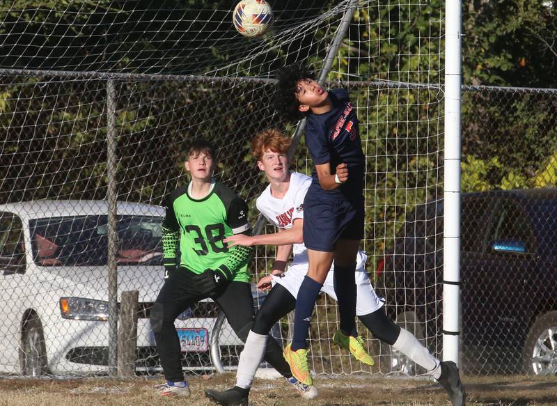 DePue/Hall's Pedro Lopez misses a header over Earlville's Jeff Peterson during the Class 1A Regional quarterfinal game on Wednesday, Oct. 16, 2024 in DePue.