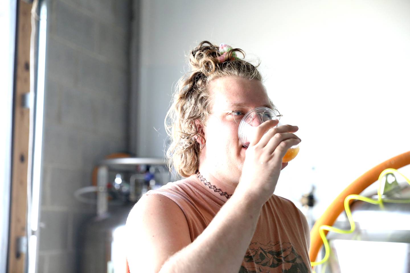 Co-founder Josh Carnell samples horchata root beer at Sunset Soda in Geneva.  Sunset Soda began producing craft soda in small batches this past March.