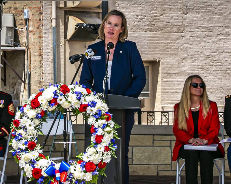 Emcee Jennifer Solum, Will County Veterans Director, speaks during the Memorial Day Commemoration at Joliet City Square.  May 20, 2026 in Joliet.