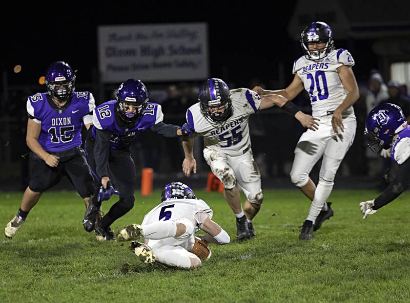 Plano’s James Brooks pounces on a fumble against Dixon Friday, Oct. 27, 2023 in Dixon.