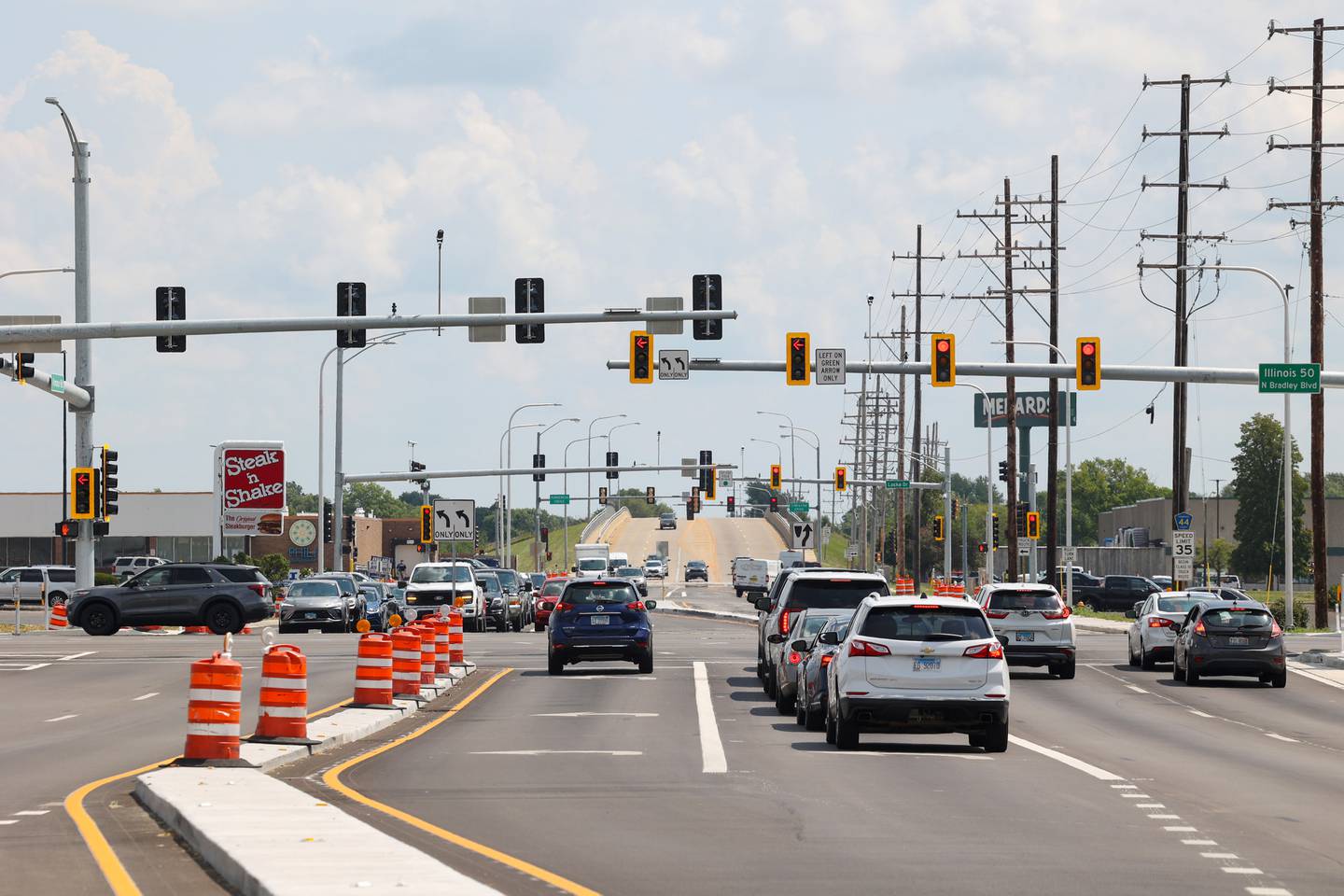 Motorists travel through the intersection at Armour Road and Bradley Boulevard (Illinois Route 50) in Bourbonnais Township on Tuesday, Aug. 12, 2025, as the Illinois Department of Transportation officially celebrated the completion of the project.