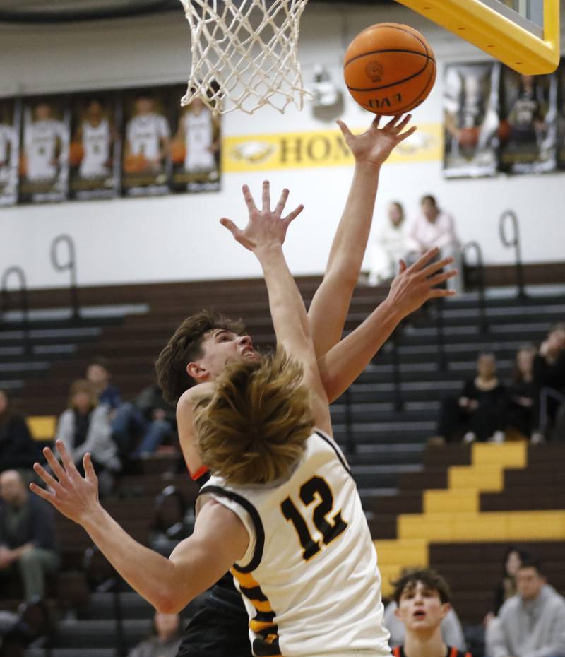 McHenry's Caleb Jett drives to the basket against Jacobs' Connor Goehring during a Fox Valley Conference basketball game on Friday, Jan. 24, 2025, at Jacobs' High School.