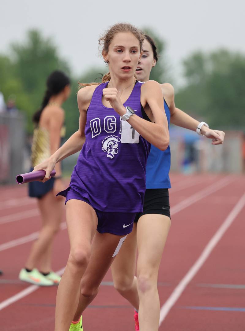 Downers Grove North's Ava Gilley (1) starts the final leg of the 4x800 Friday, May 12, 2023, at the Class 3A Lockport Sectional.
