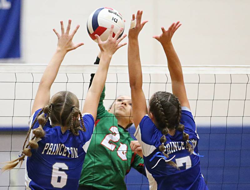 L-P's Ava Currie gets the ball past Princeton's Caroline Keutzer and teammate Kathy Maciczak on Tuesday, Aug. 27, 2024 at Princeton High School.