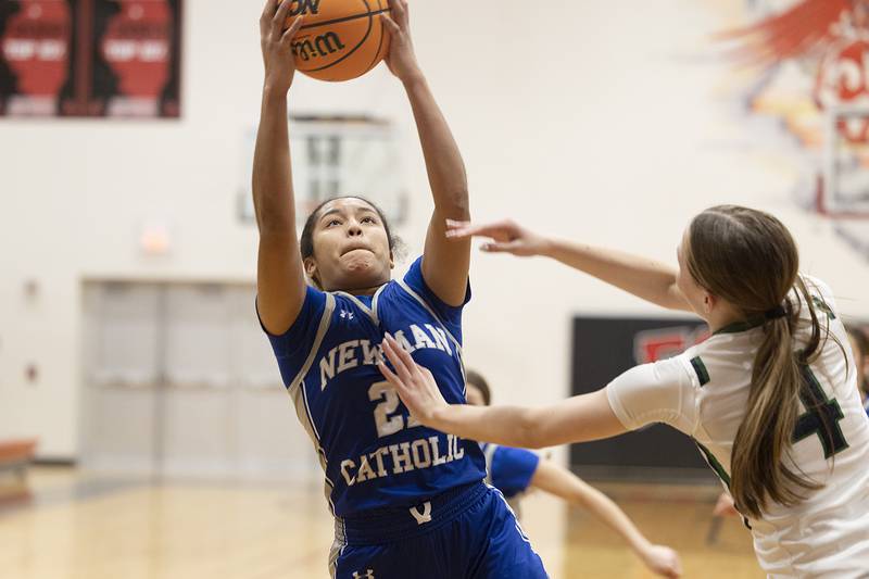 Newman’s Gisselle Martin pulls down a rebound against River Ridge Thursday, Feb. 20, 2025, during the Class 1A girls basketball regional at Forreston.