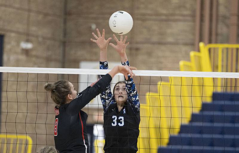 St. Francis’ Emma Delaney goes up for a block Friday, Nov. 4, 2022 during the Spartan’s 3A supersectional game against Metamora.