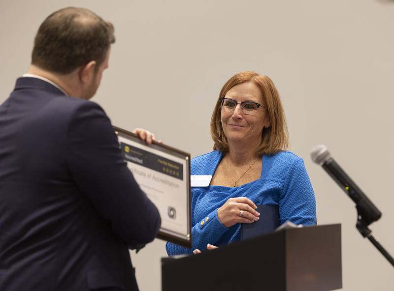 Kevin Courtois presents SVACC director Kris Noble with a 5-Star U.S. Chamber of Commerce accreditation award. One percent of chambers receive such a recognition.