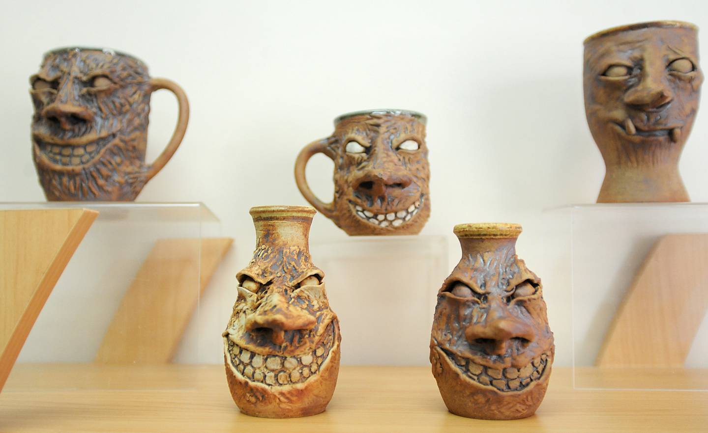 Face mugs made by artist Deanne Ferguson inside the guild's new Artisans on Main gallery on Thursday, March 10, 2022. The Clayworkers' Guild of Illinois recently moved out of the Old Courthouse and Sheriff’s House in Woodstock to a new gallery and workshop space at 220 Main St.