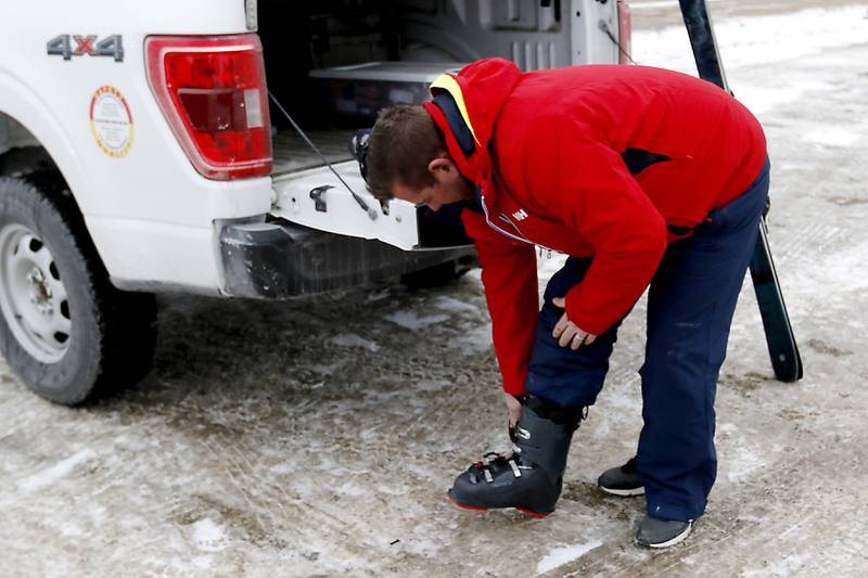 Nick Capp of Antioch puts on his ski boots at Wilmot Mountain Ski Resort on Thursday, Jan. 16, 2025, in Wilmot, Wisconsin.