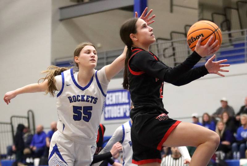 Huntley’s Alyssa Borzych, right, soars past Burlington Central’s Scarlett LaFleur in varsity girls basketball on Monday, Feb. 9, 2026, at Central High School in Burlington.