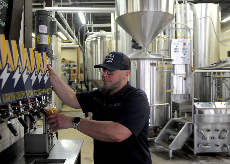 Greg Doyen, the new owner of Scorched Earth Brewing, pours a pint Tuesday, May 10, 2022, at the brewery at 203 Berg St. in Algonquin.