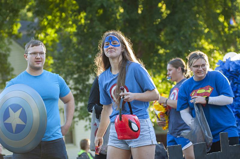Rock Falls senior class members throw out candy Thursday, Sept. 22, 2022 at the homecoming parade moves through the city. The school hopes to channel their superhero themed homecoming when they face G-K Friday night on the gridiron.