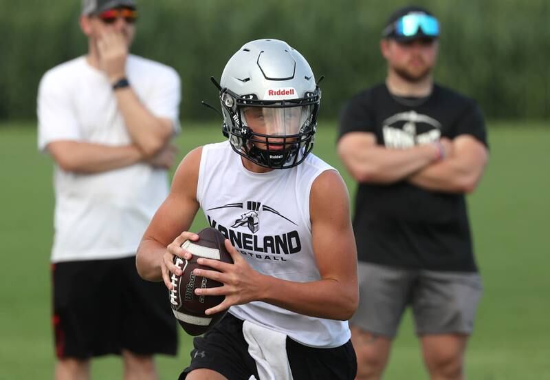 Kaneland’s Chase Kruckenberg rolls out as his coaches look on Tuesday, July 16, 2024, during their matchup against Geneva in the Kaneland 7-on-7 at the school in Maple Park.