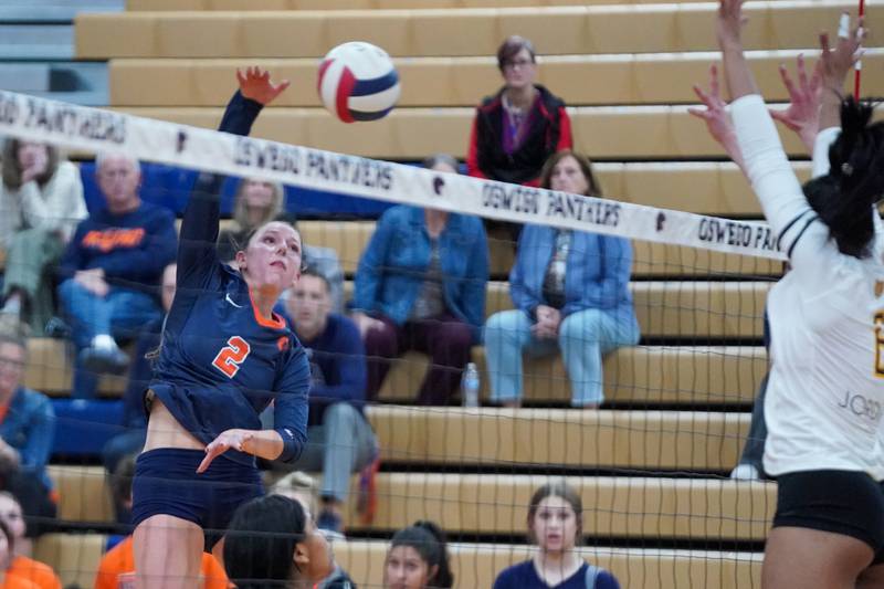Oswego’s Kelsey Foster (2) goes up for a kill attempt against Joliet West during a volleyball match at Oswego High School on Thursday, October 24, 2024.