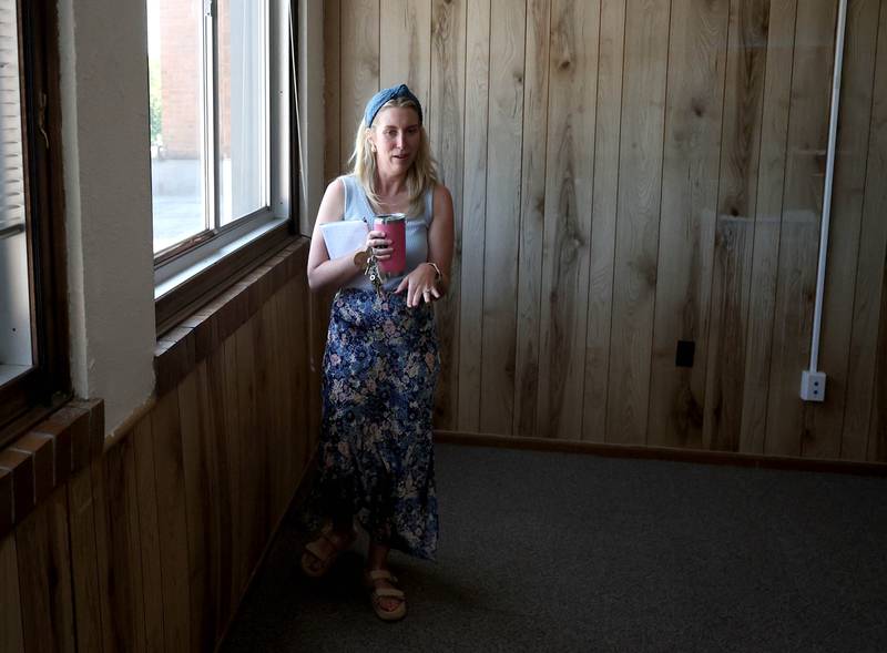 Lauren Holtz, director of communications and community engagement for Sycamore School District 427, talks Tuesday, June 18, 2025, about one of the classrooms at the former Central School in Sycamore. The nearly century old building currently houses the district offices but will soon be for sale. The district is hosting an open house at the building Saturday, June 21.