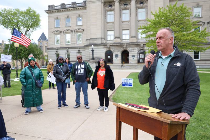 Larry Kerkstra, Kankakee County Board member, speaks during the May Day Strong rally at the Kankakee County Courthouse on May 1, 2026, as part of a national day of action.