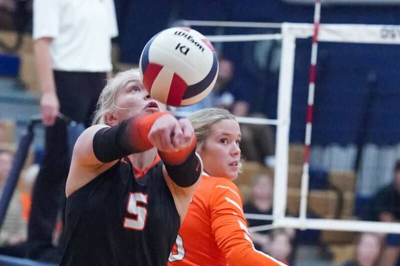 Minooka's Kira Cailteux (5) bump sets the ball against Oswego during a volleyball match at Oswego High School on Thursday, Oct. 3, 2024.