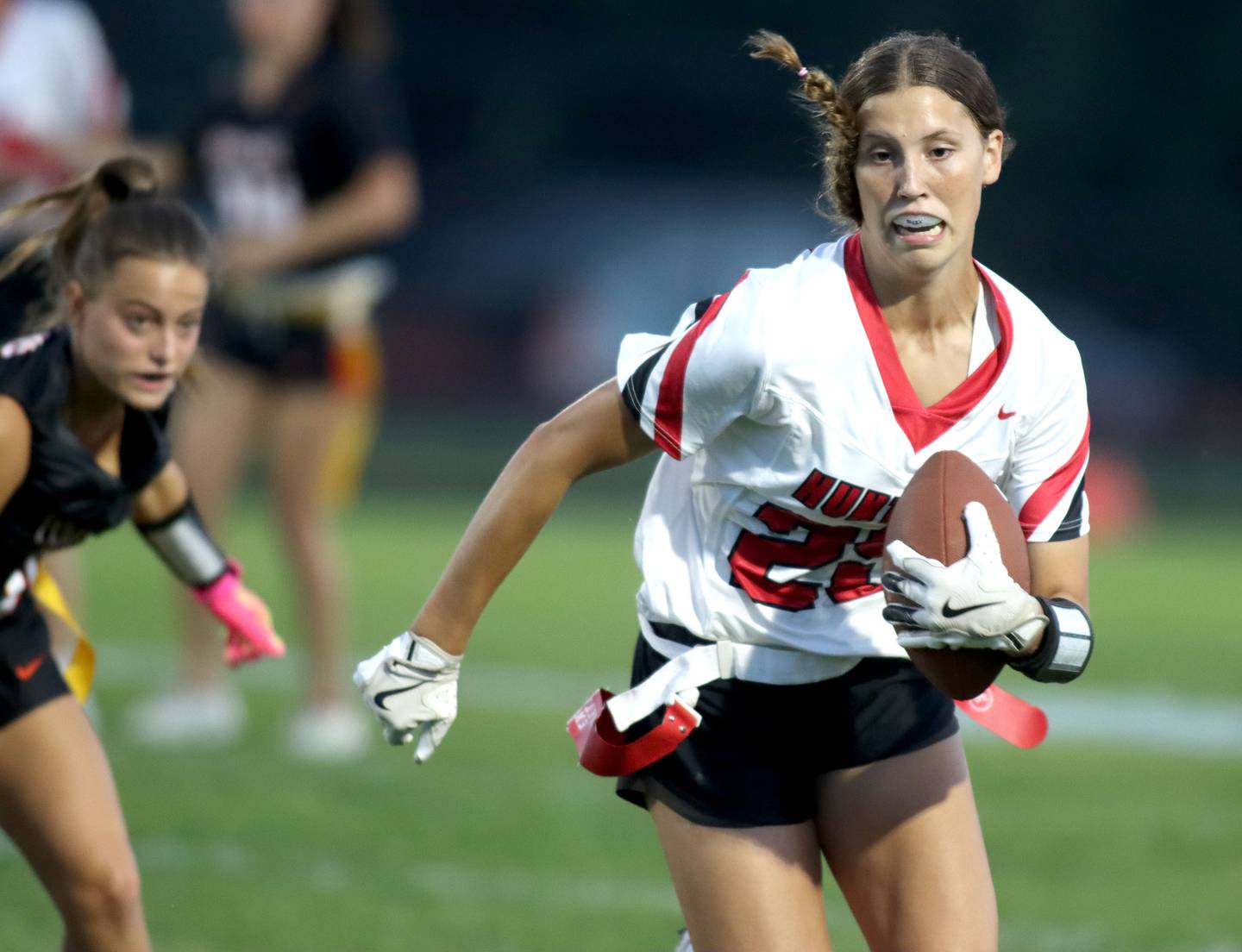 Huntley’s Evelyn Freundt runs the ball in varsity flag football at Owen Metcalf Field on the campus of Crystal Lake Central High School in Crystal Lake on Tuesday, Sept. 16, 2025.