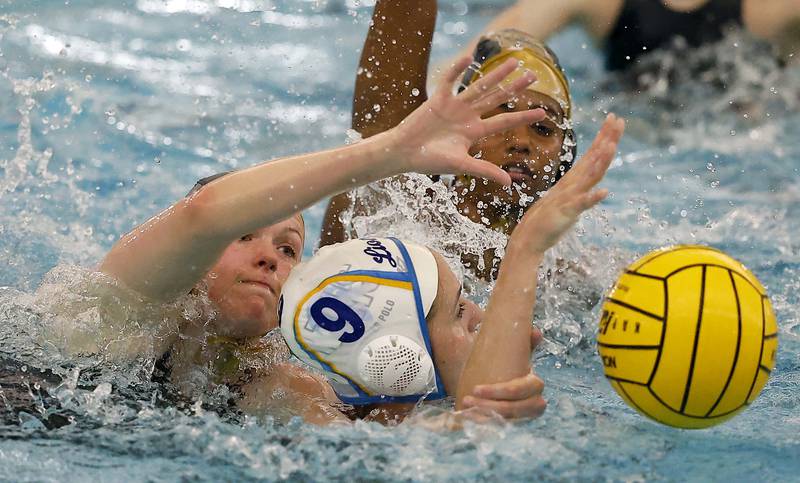 Lyons Township's Maya Mladjan (9) is pressured by Stevenson's Jillian Carlson (6) and Dhanani Seneviratne (4) during the IHSA State Finals of the Girls Water Polo Saturday, May 24, 2025 at Stevenson High School in Lincolnshire.
