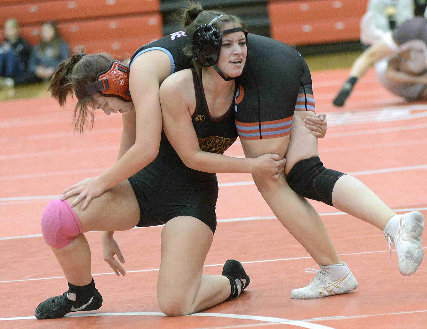 Morris’ Ellie Evans works to escape  from hold by Ottawa’s Isabel Gwaltney in the 105-pound girls  match Wednesday at Ottawa.