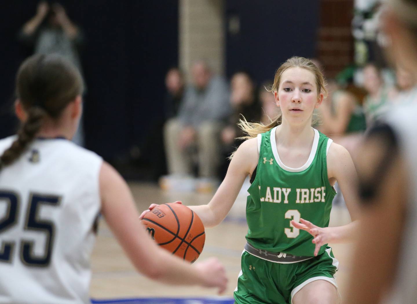 Seneca's Evelyn O'Connor dribbles the ball up the floor as Marquette's Chloe Larson defends in Bader Gym on Monday, Jan. 23, 2023 at Marquette High School.
