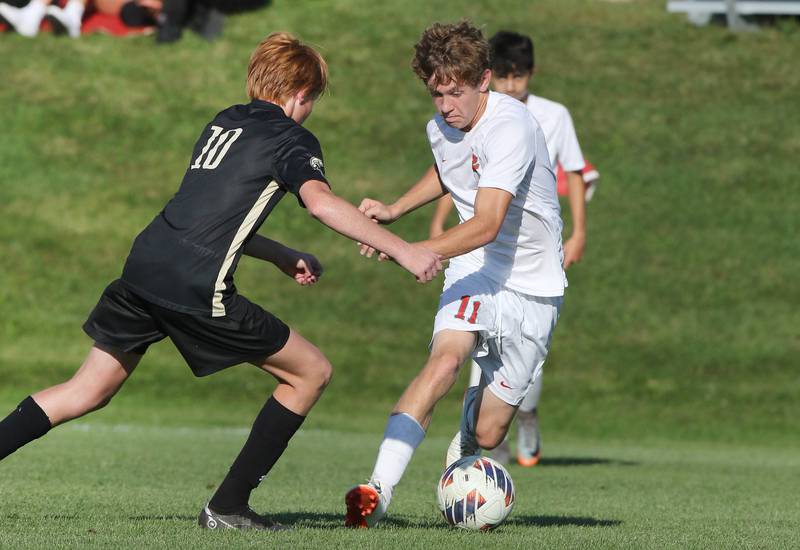 La Salle-Peru's Jason Curran tries to get by Sycamore's Jameson Carl during their game Wednesday, Sept. 7, 2022, at Sycamore High School.