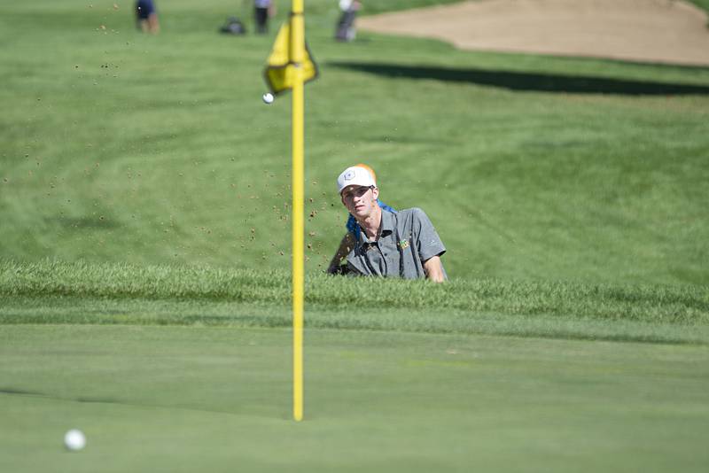 Crystal Lake South’s Nate Stewart blasts out of the trap on no. 3 at Emerald Hill in Sterling for the Class AA IHSA sectional golf meet.