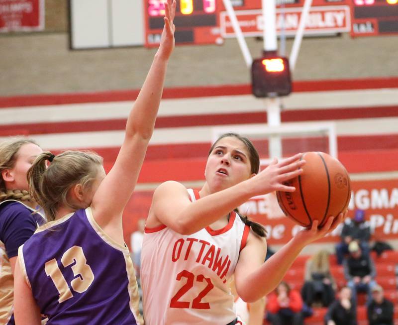 Ottawa's Marlie Orlandi (right) looks to shoot a basket over Canton's Karlee Zumstein (left) during the Lady Pirate Holiday Tournament on Wednesday, Dec. 21, 2022 in Ottawa.