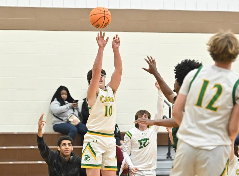 Providence Catholic's Cade Styrsky (10) shoots a 3 point shot from the corner during the WJOL tournament game against Plainfield Central on Friday, NOV. 28, 2025, at Joliet.