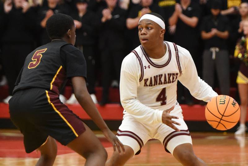Kankakee's Myair Thompson, right, looks up the floor as he brings the ball up while under pressure from East Peoria's Kingston Weatherspoon during the IHSA Class 3A Ottawa Sectional semifinals Wednesday, March 4, 2026.