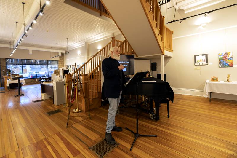 Sauk Valley Community College Art Professor Glenn Bodish acts as judge Friday, March 28, 2025, for a student art show at The Next Picture Show in Dixon. For the first time, the gallery hosted a show for students in grades 9-12. The show will be on display until April 26.
