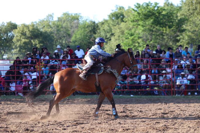 Amarissa Hughes, 10, of Crete, accelerates to finish in the junior barrel races during the 50th Pembroke Rodeo on Sunday, May 24, 2026.
