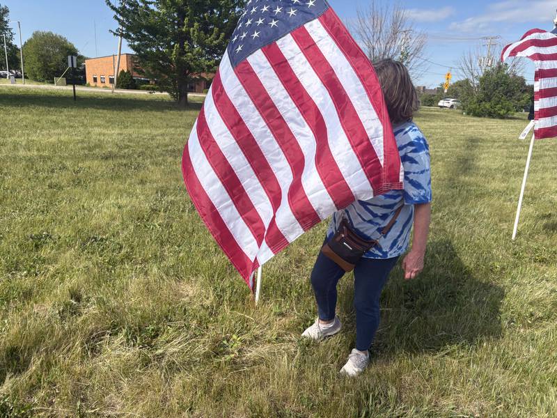 Linda Sorensen looks for servicemembers she knows at the Field of the Fallen in Cary May 23, 2026.