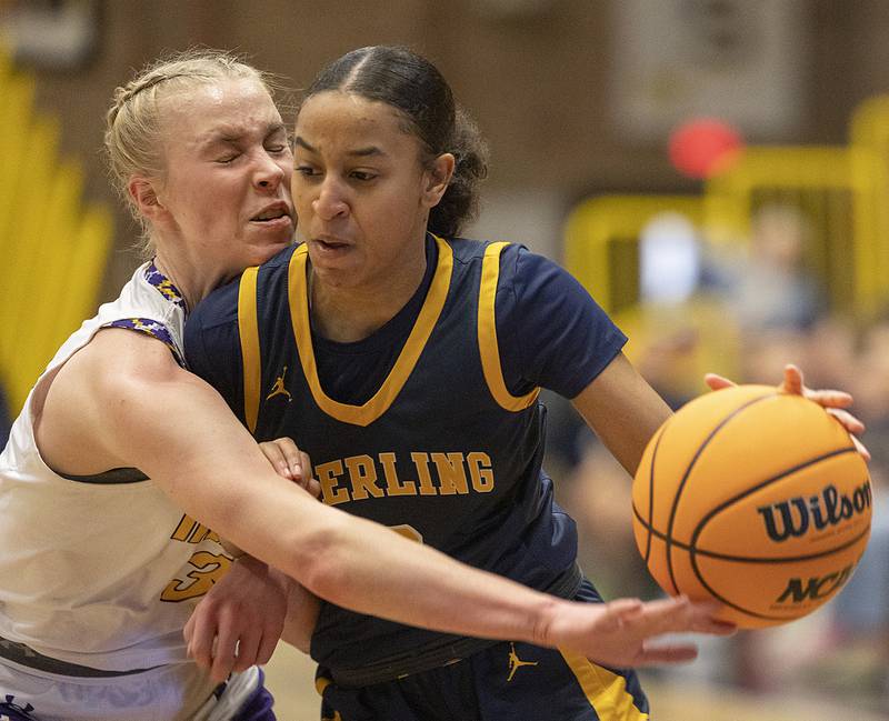Hononegah’s Jordan Dimke works against Sterling’s Alivia Gibson Saturday, Dec. 21, 2024, during the Sterling Shootout.