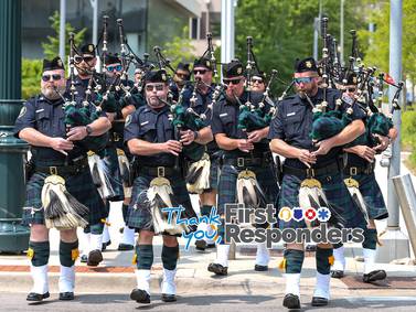 Joliet police pipe and drum band plays on