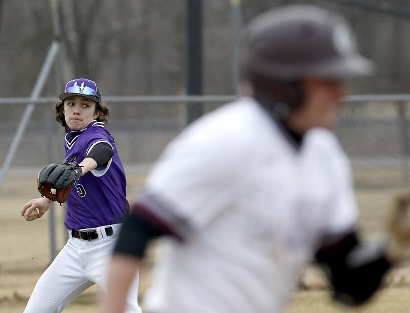Hampshire's Daniel Rodriguez throw to first to get Marengo's Ty Sierpien out during a non-conference baseball game Wednesday, March 30, 2022, between Marengo and Hampshire at Marengo High School.